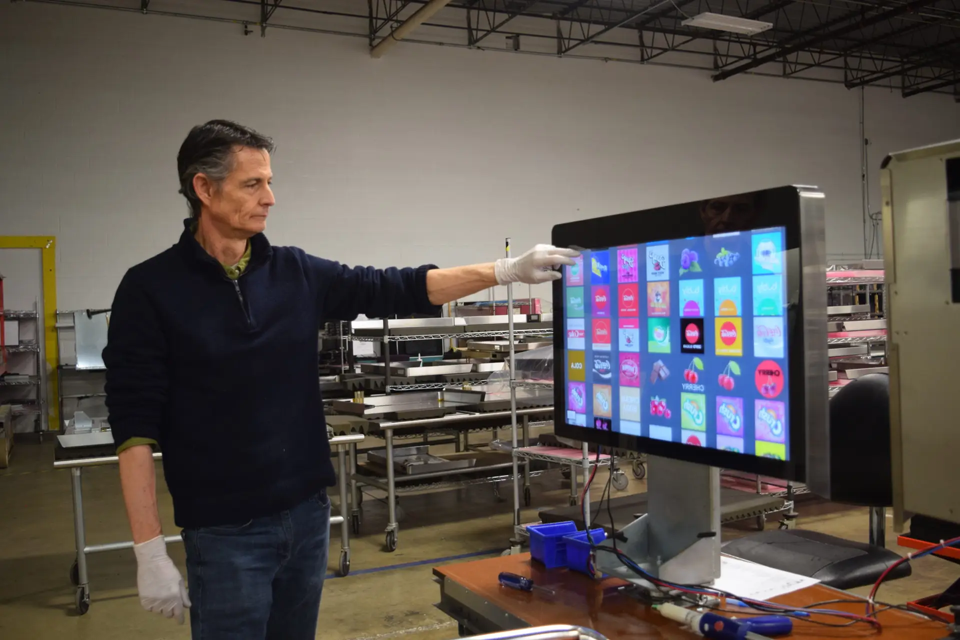 a-man-standing-in-front-of-a-computer-screen